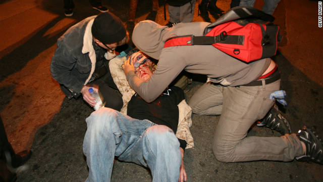 Occupy Oakland protesters tend to Scott Olsen -- who was injured in a Tuesday night protest.